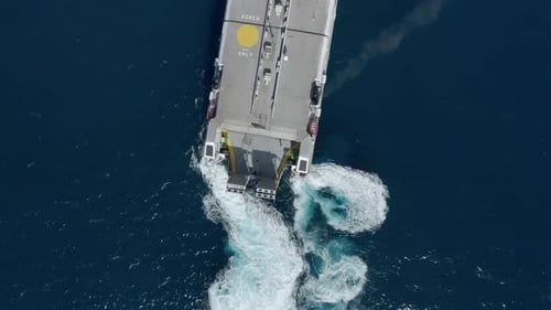 Cargo passenger ship ferry turning in blue water