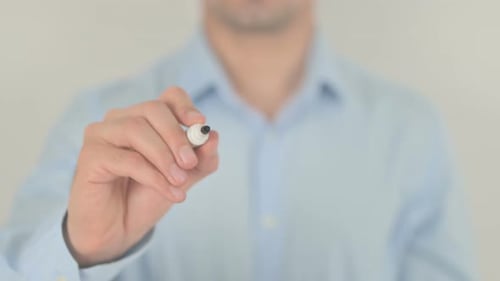 Man Writes "Facts" with Marker on Clear Surface