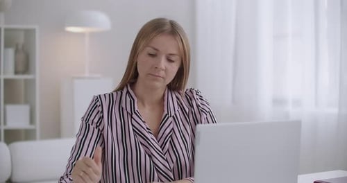Female Student Is Learning in Home, Tired and Depressed Woman, Rubbing Temples and Relaxing