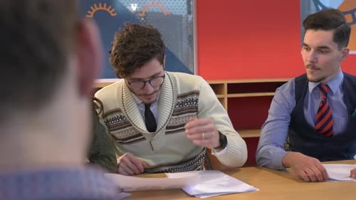 Young people checking documents