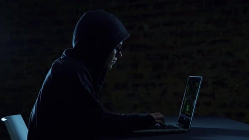 Hacker using laptop
