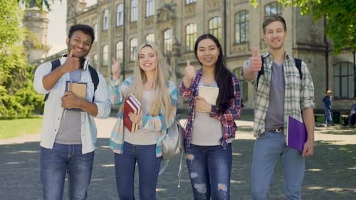 Smiling Students Give Thumbs Up at College