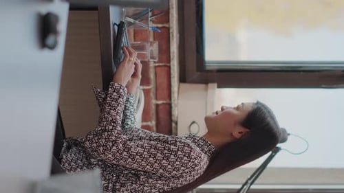 Vertical Video Close Up of Woman Working on Project Planning with Computer