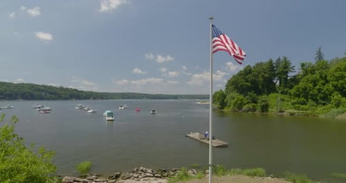 Lake with Boats and an American Flag