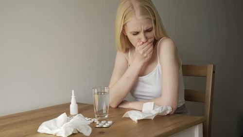 Woman Suffering from Cold and Flu Indoors