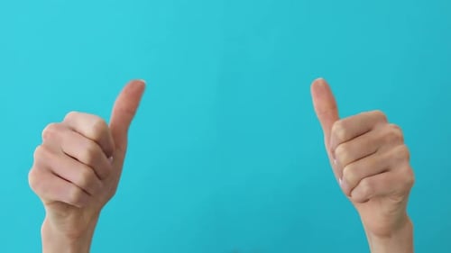 Hands Doing Thumbs Up Gestures on Blue Background