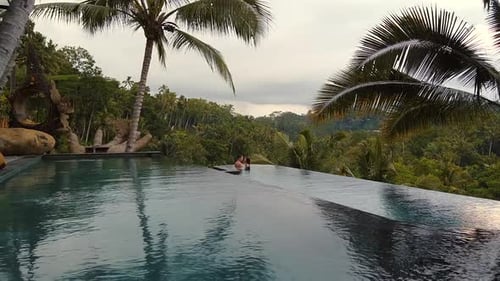 Couple Kissing Inside the Pool in Ubud Bali