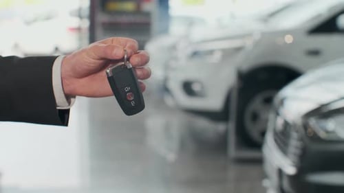 Salesman Dealer Hold a Car Keys.