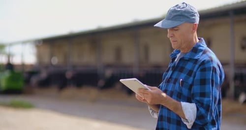 Farmer using digital tablet