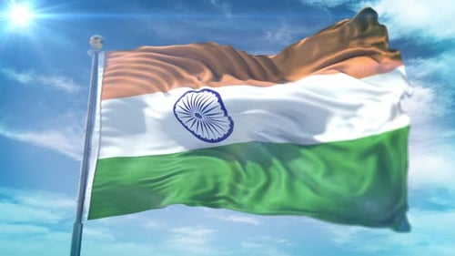 Indian National Flag Waving Against Blue Sky