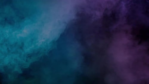 Colorful Smoke Swirling Against Black Background