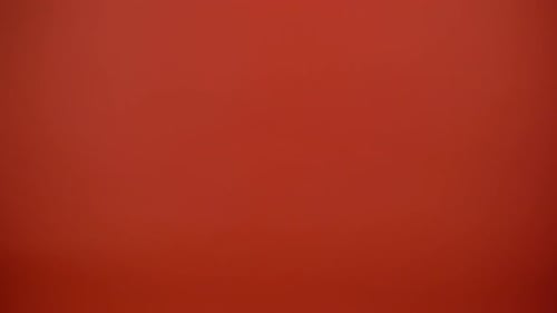 Gifts Tossing Close Up on Red Background