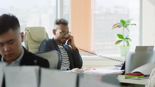 Office Worker Having Phone Conversation