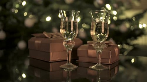 Sparkling Drinks and Gifts near Christmas Tree