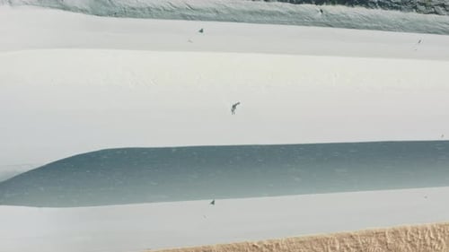 Soft Snow Falling on Snowboard Half Pipe Freerider Jumping High Above Slope