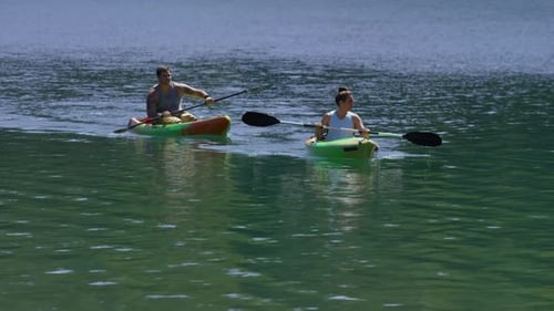Couple kayaking in lake