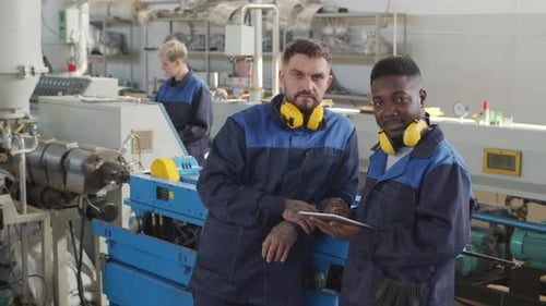 Portrait of Plant Workers Looking at Camera