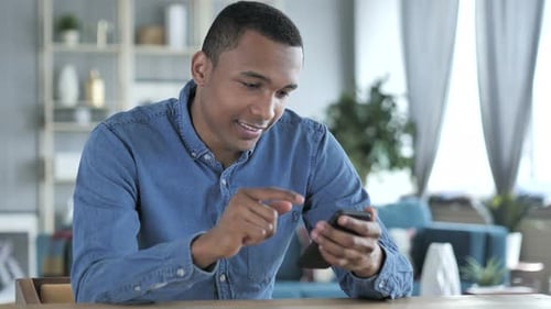 Man Using Smartphone at Home, Indoors