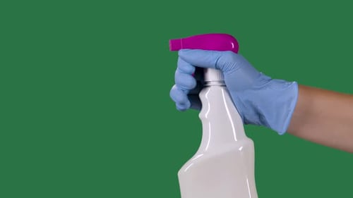Man in Protective Gloves Sprays a Cleaning Hygienic Spray for Disinfection and Prevention of COVID