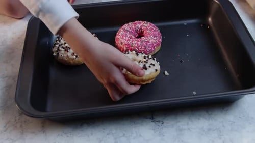Family Enjoys Decorated Donuts Near Christmas Tree