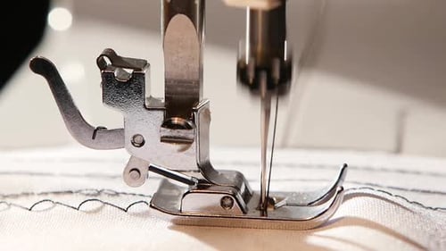 Sewing Machine Needle Stitching Fabric Close Up