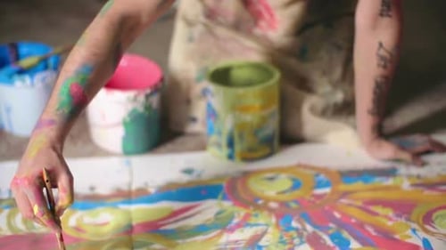 Artist Painting a Colorful Abstract Image in Studio