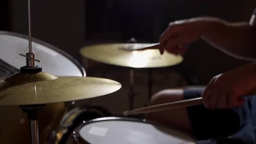 Drummer Playing a Drum Kit Close Up