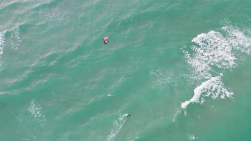 Kitesurfer Rides Ocean Waves Aerial Birds Eye View