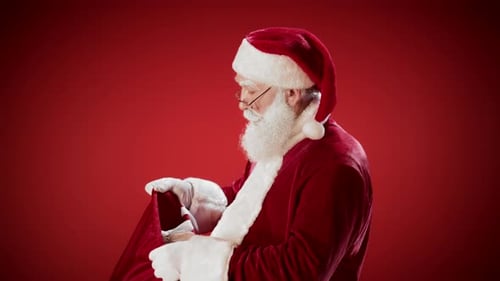 Santa Claus with Christmas Gift on Red Background