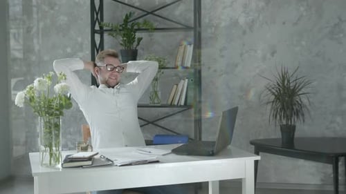 Work Online, Man Works at Laptop and Is Satisfied with Work Holds Hands To Sides, Young Businessman