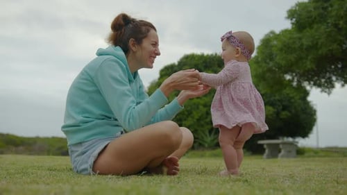 Happy Little Baby Girl Playing Together with Her Mother Outdoor in the Park Adorable Baby Lifestyle