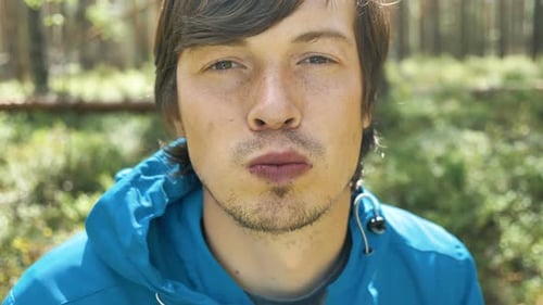 Young Man Eating Forest Berries Close Up