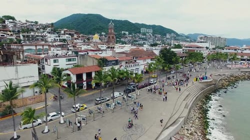 Coastal City Promenade with People Walking Aerial Shot