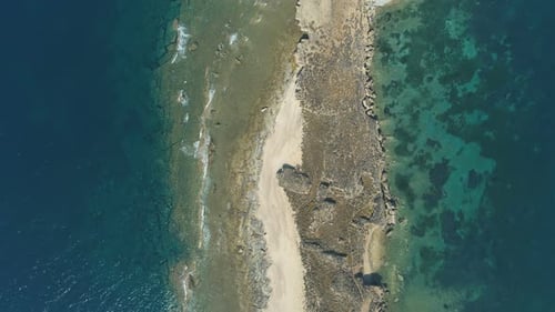 Top View of Waves Crashing in Rocky Sand Beach in Lemnos Island, Greece