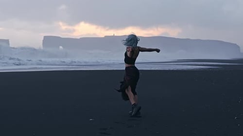 Spinning Cool Girl On Black Sand Beach