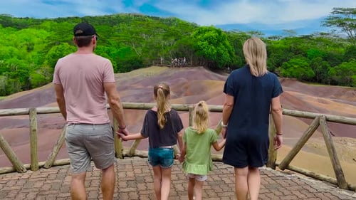 Back View Father with His Happy Family Walking