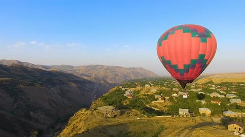 Hot Air Balloon Flying Over Beautiful Armenian Halidzor Village and Mountains