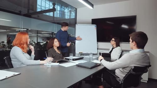 Business Presentation at Corporate Meeting in Modern Office