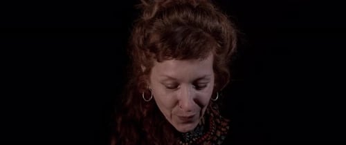 Woman Looking Up, Red Curly Hair, Black Background