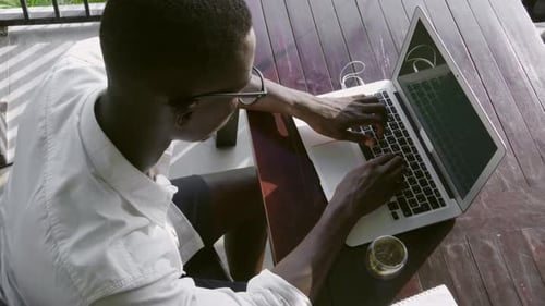 Man Working on Laptop Computer