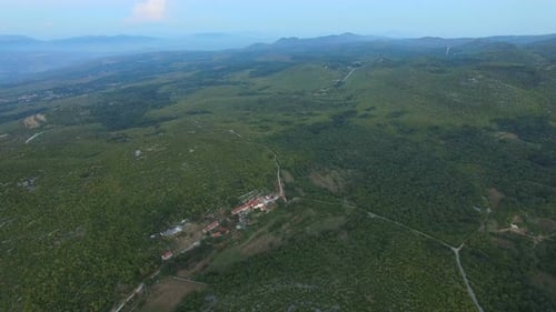 Aerial view of remote village in green peaceful valley