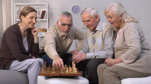 Seniors Enjoying Chess Game Together Indoors