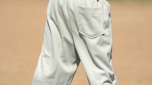 Kids playing little league baseball.