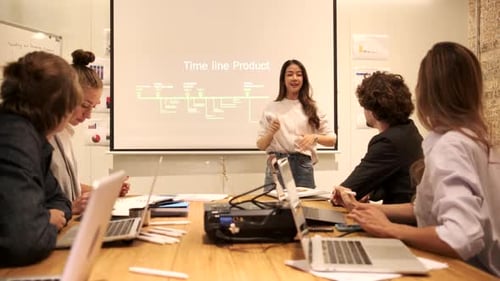 Business Team Applauds Presentation in an Office