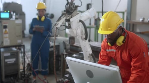 Engineers Manage Advanced Robotic Arm in Bright Factory