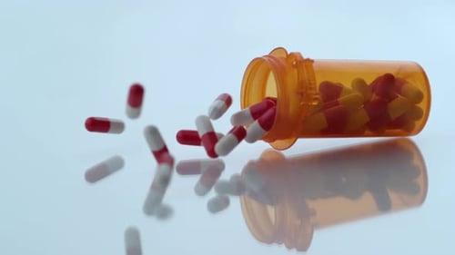 Pills Spill From Prescription Bottle Macro