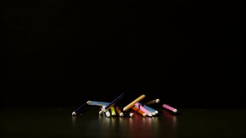 Colored Pencils Falling in Slow Motion