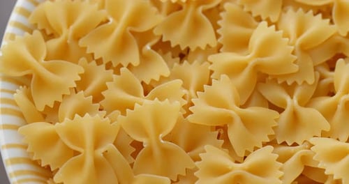 Bowl of uncooked bow-tie pasta