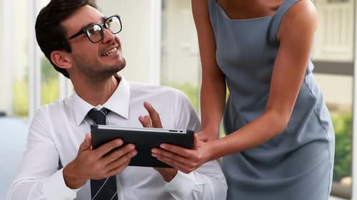 Business People Working Together on Tablet