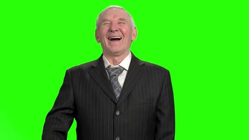 Laughing Senior Man in Suit on Green Screen